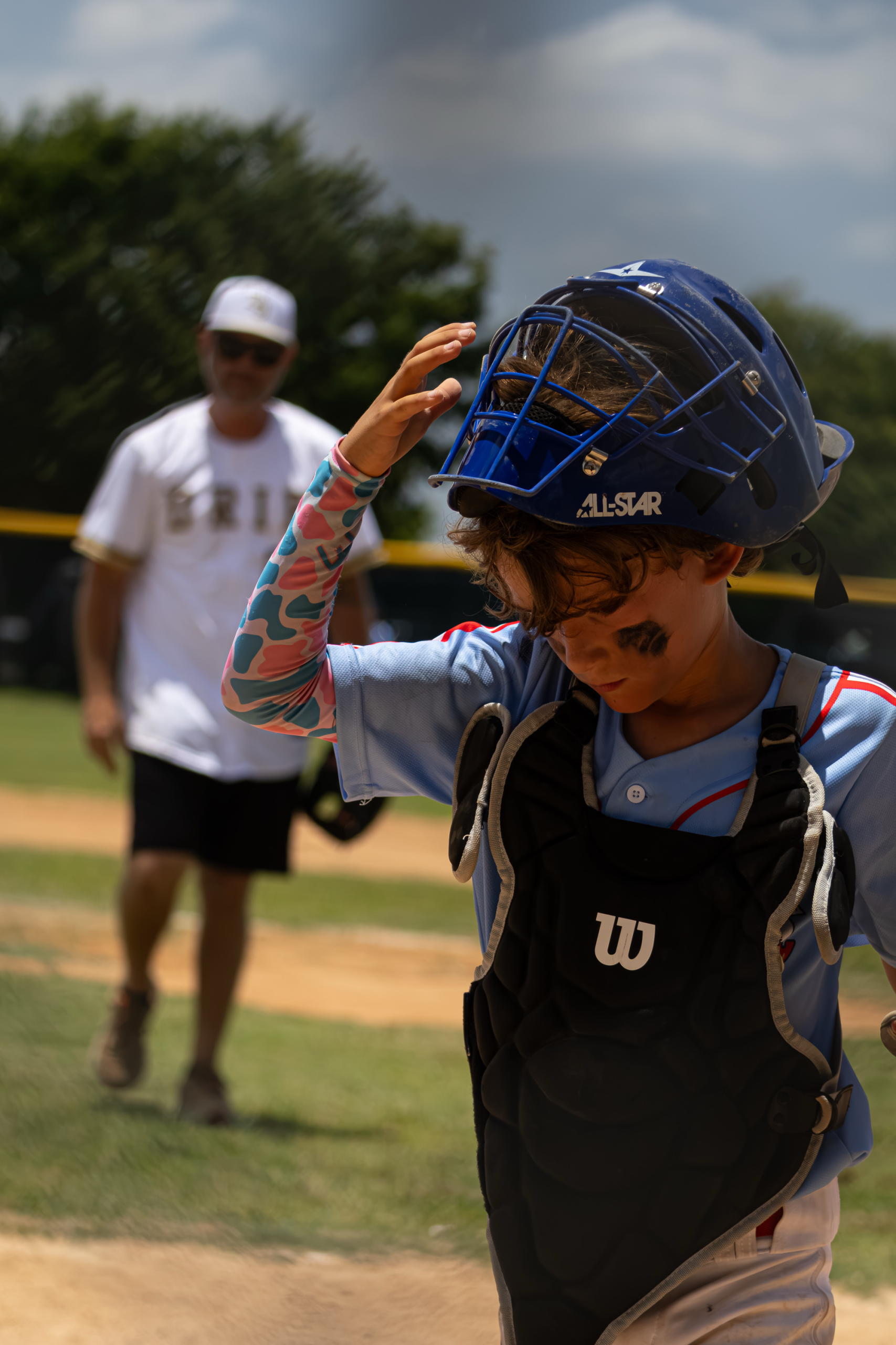 Mudbugs youth baseball catcher on the field