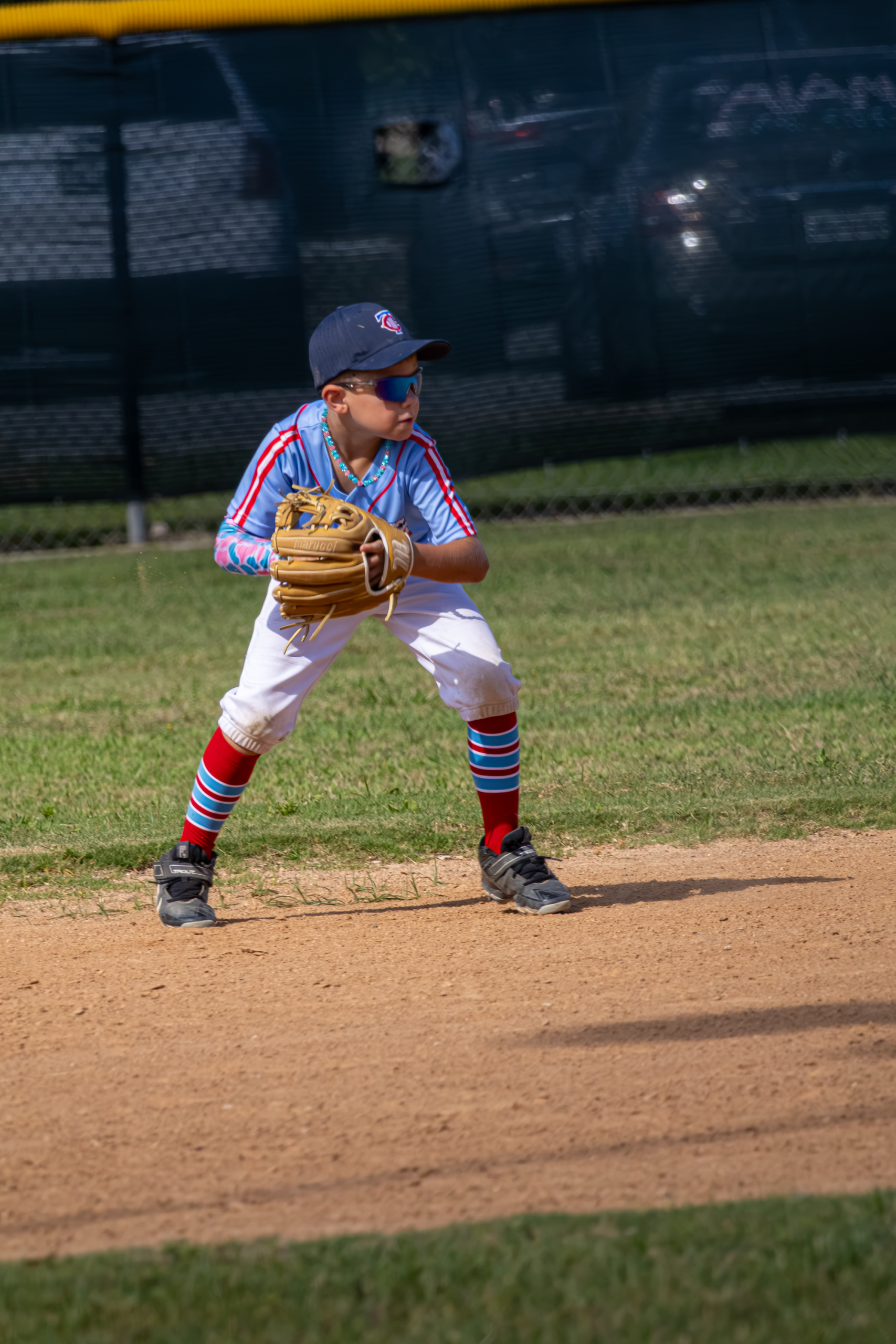 Mudbugs youth baseball player fielding