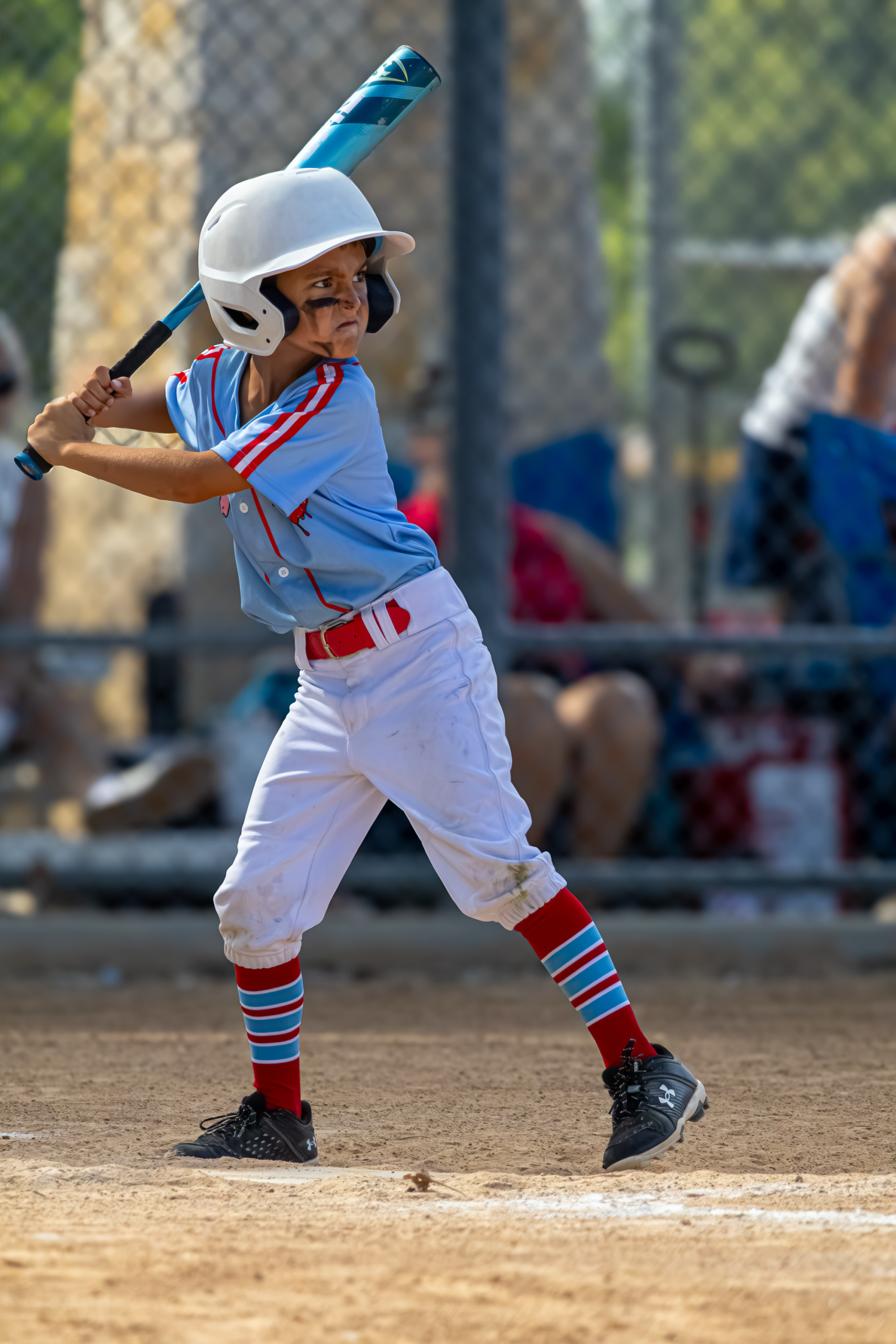 Mudbugs youth baseball batter preparing to swing